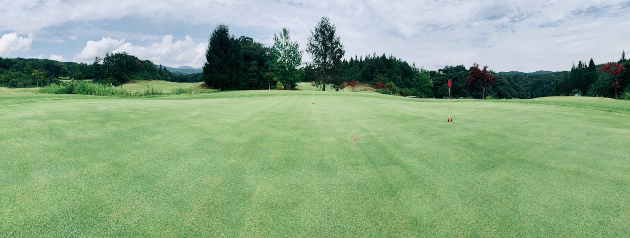 Practice green behind the clubhouse.